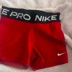 women’s red nike pros size small